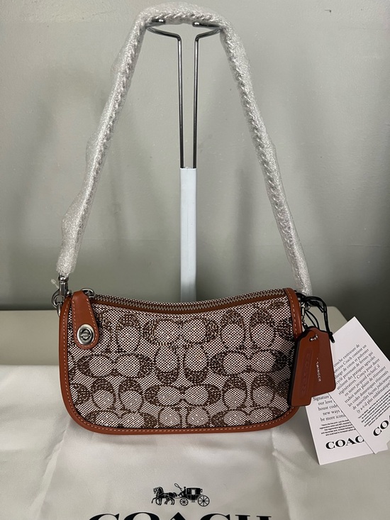 Coach Handbags - Coach Swinger Bag 20
With Chain In Crystal Signature Jacquard